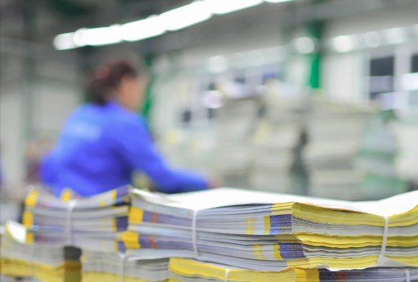 Stacks of printed materials in a print production facility